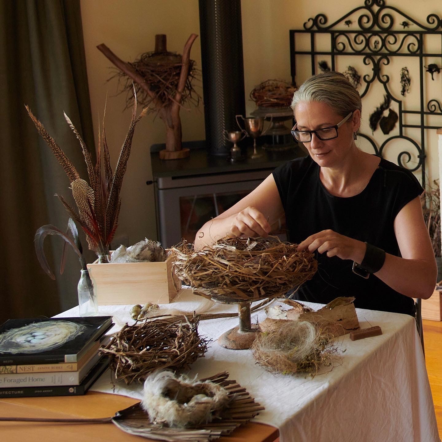 Zora Verona creating nest sculptures in her home studio.